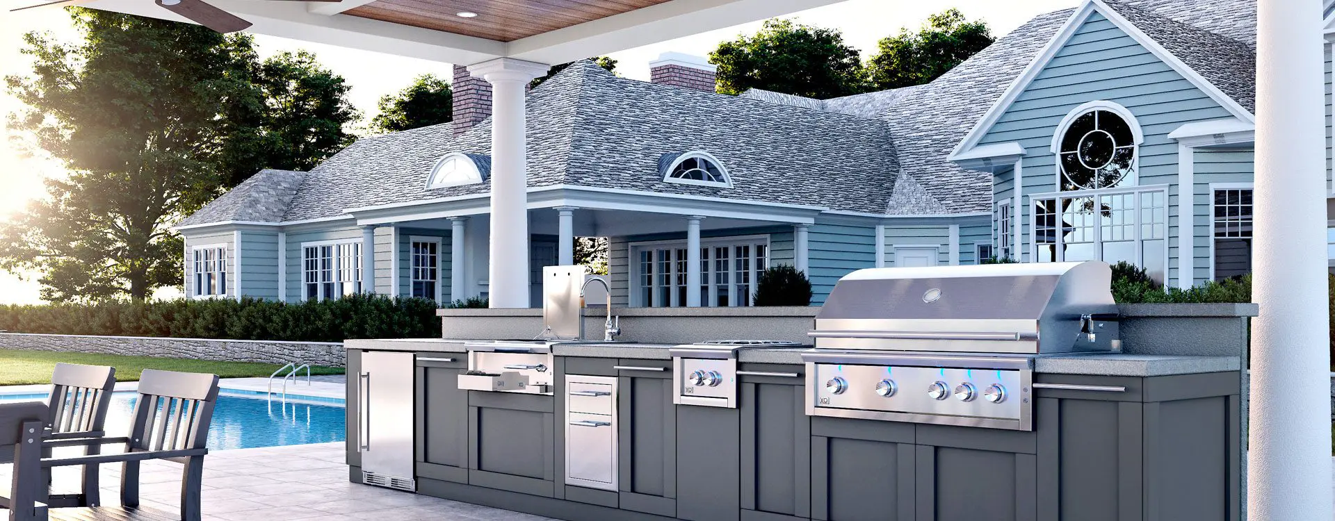 XO outdoor kitchen with stainless steel appliances beside the pool