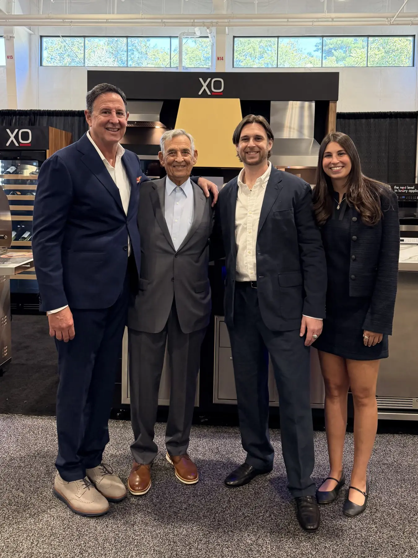 Craig, Marty, Alec and Lindsay Friedman together at an XO display